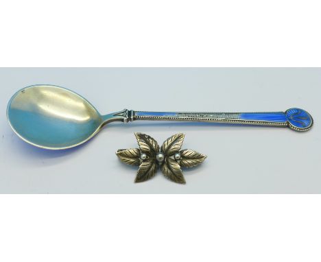 A Danish silver brooch, John L, Denmark, (John Lauritzen), and an enamel spoon, enamel a/f