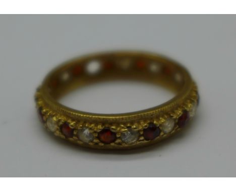 A 9ct gold, red and white stone eternity ring, 3.0g, S