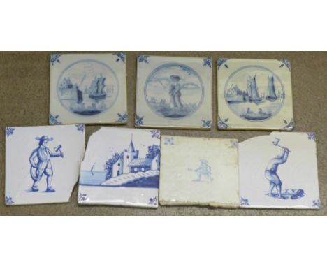 Seven blue ceramic Delft tiles, some a/f