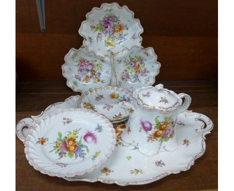 A Dresden floral hand decorated strawberry dish, tray, teapot (spout a/f), two saucers and side plate