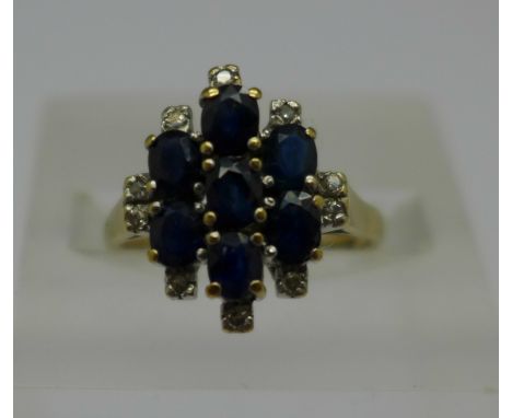 A 9ct gold, sapphire and white stone cluster ring, 2.7g, K