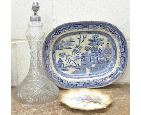 A tall cut glass table lamp base, a 19th Century Willow pattern serving plate and a Doulton floral plate