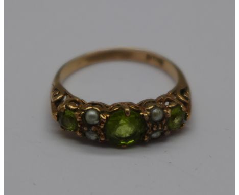 A yellow metal, peridot and seed pearl ring, marked 9ct, 2.6g, P