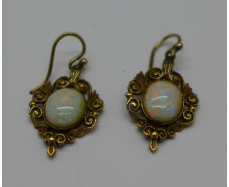 A pair of opal set earrings