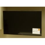 A Panasonic 32in Television with remote.
