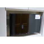 A Panasonic 32in Television with remote.