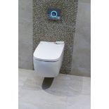 A VitrA V-care Prime Wall Hung Display Toilet with heated seat, spray and drying functions and