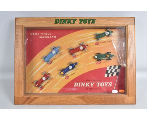 A REPRODUCTION DINKY TOYS WORLD FAMOUS RACING CARS COUNTER TOP DISPLAY, with the six correct repainted and restored racing ca