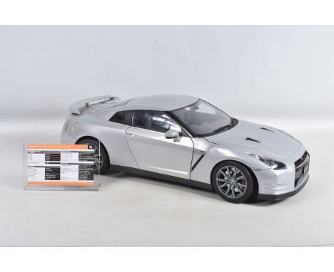 A BUILT EAGLEMOSS NISSAN GT-R PURE EDITION 2011 1:8 SCALE MODEL, approximate 58cm in length, model appears largely complete, 