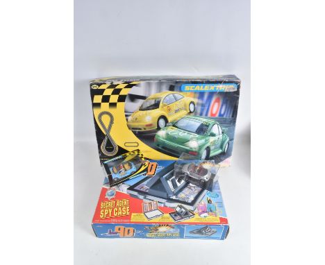 THREE SCALEXTRIC BOXED VOLKSWAGEN BEETLE MODEL TOYS AND A JOE 90'S SECRET AGENT SPY CASE, to include two VW Beetles models wi