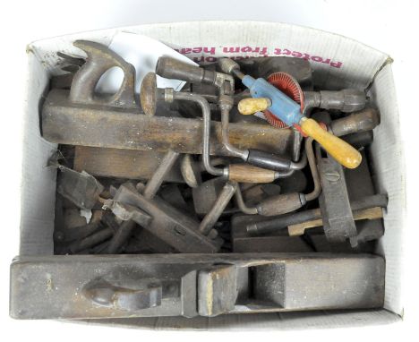 A collection of vintage tools including drills, planes, clamps and more