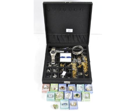 A large selection of costume jewellery, in a jewellery box, including a silver bangle, chains, rings and more