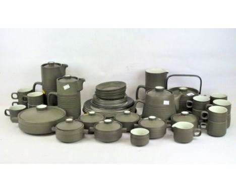 A Denby part tea and dinner service, in dark green glaze with light green interiors, comprising cups, saucers, jugs, plates, 