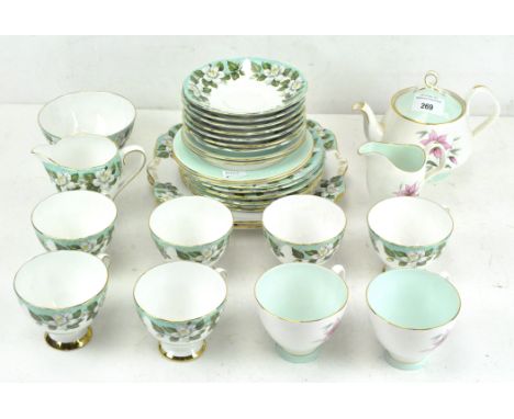 A Gladstone bone china 'Montrose' patterned part tea service, comprising cups, saucers, a milk jug, sugar bowl and plates, to