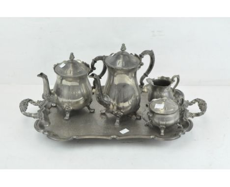 A Victorian silver plated tea service, decorated with scrolling motifs, comprising a teapot, jug, sugar pot and coffee jug, a