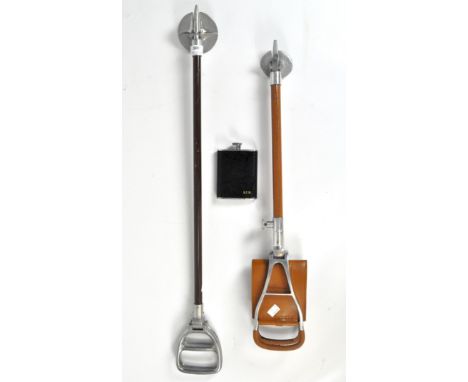 Two shooting sticks and a hip flask, one stick with tan leather mounts, the hip flask initialled R.F.W. with black leather co