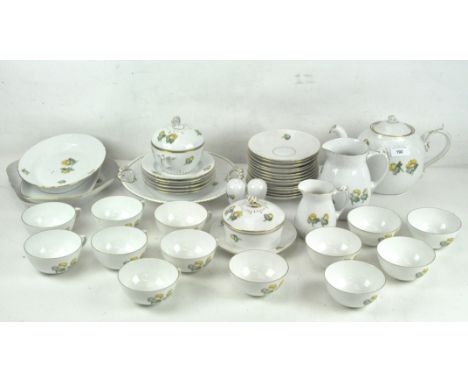 A Danish Bing &amp; Grondahl tea service, decorated with yellow flowers on a white ground, gilt rims, comprising tea cups, sa