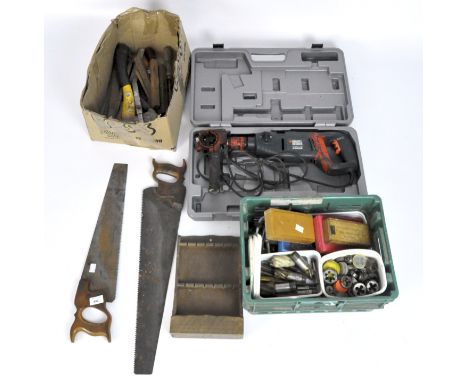 Assorted tools and drills including vintage saws, drill bits, a large Black and Decker drill, KD795CRE  in a case, and more