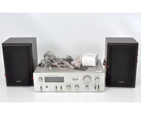 An Eagle A8500 Stereo Amplifier, made in Korea, together with a pair of Technics SB-HD301 speakers