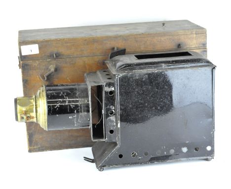 An early 20th century Magic lantern projector, black painted with brass detailing, in original wooden carrying box