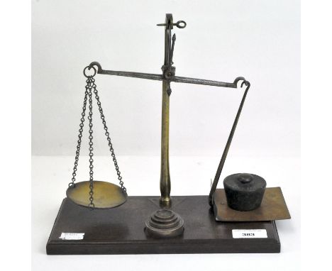 A set of late Victorian/Edwardian balance scales, with brass fittings and weights, on oak stand, 26.5cm high