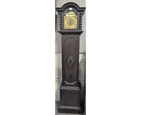 A 20th century grandmother clock, brass dial with Roman numerals and engraved 'Tempus Fugile', in oak case flanked by barley 