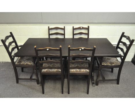 A modern dark stained dining table and six chairs with tapestry style upholstery, height 94cm