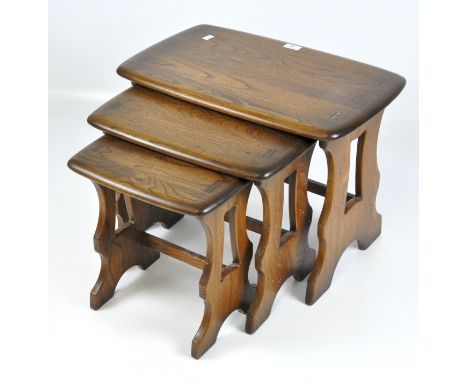 An Ercol nest of three tables, the largest 41cm x 57cm x 35cm