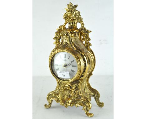 A reproduction 19th century style mantel clock by Robert Grant of London, the dial with Roman numerals denoting hours, quartz