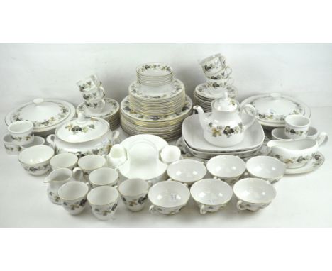 An extensive Royal Doulton 'Larchmont' pattern tea and dinner service, to include tureens, ramekins, two handled soup bowls e
