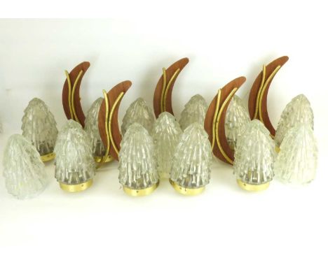 Five 1970s double wall lights with teak crescent back and brass tubular lamp mounts forming part of the decoration and two pr