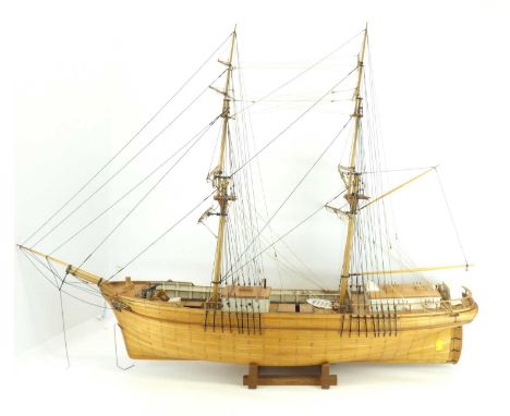 A 20th century wooden model of a two-masted sailboat, possibly scratch built, on a wooden base.Height 77cm, length 105cmAll t