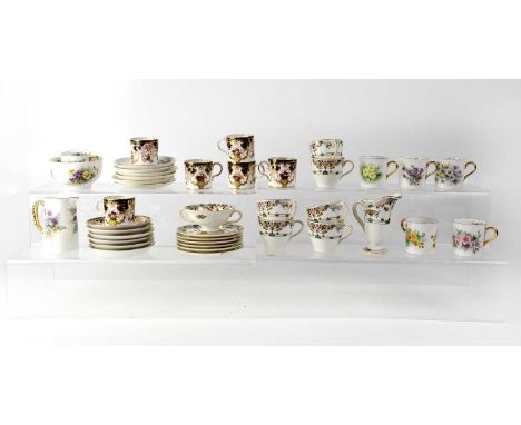 Three porcelain part coffee sets comprising an Aynsley thistle decorated six-piece set, signed M Allingham, a Royal Crown Der