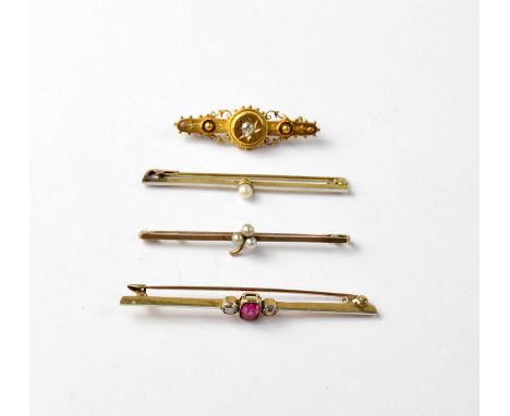 Four Victorian and Edwardian bar brooches comprising a 15ct yellow gold bar brooch with central emerald cut ruby and small di