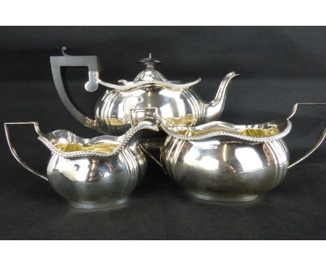 A George V hallmarked silver three-piece tea set, Henry Clifford Davies, Birmingham 1919, height of teapot 14cm, handle to sp