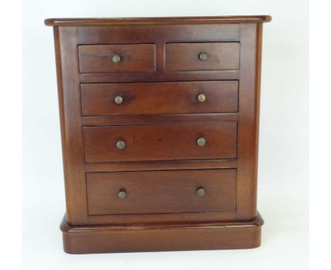 A mahogany tabletop miniature chest of two-over-three graduated drawers (to replicate a Scotch chest).40 x 36 x 17cmThere was