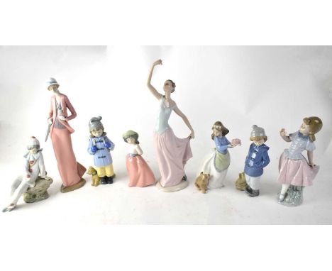 NAO; eight figures to include a lady in elegant Edwardian costume, ballerina (af), seated Pierrot, three figures of young gir