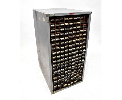 A mid-20th century plan chest with eighty apertures for rolled documents or plans, wooden interior with grey metal surround.1