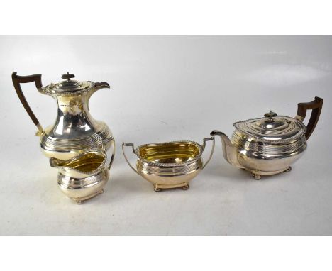 JAMES DIXON &amp; SONS; a George V silver four-piece tea set of oval form with reeded decoration and gadrooned borders, compr