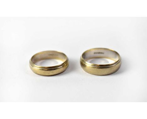 A pair of 9ct white gold wedding bands, inscribed to interior 'Forever entwined', widths 6mm and 5mm, sizes R and P, combined