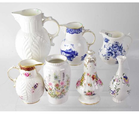 COALPORT; a white ground 'The Caughley' mask head jug, originally produced around 1770, height 19cm, a mask head jug with han