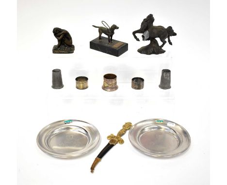 A collectors' lot comprising a bronzed model of a dog raised on stand, a sword-form letter opener, etc.