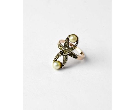 An Art Deco 9ct gold ring with figure of eight table with white stones and two simulated pearls, size H, approx. 3g.The white