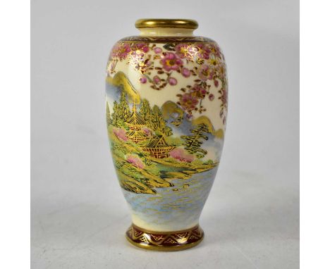 An early 20th century Satsuma baluster vase with polychrome enamelled scene of idyllic village with pagodas, flowing water, m