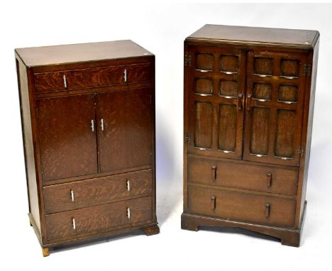 A reproduction oak tallboy with pair of fielded panel doors above a base of two drawers, raised on bracket feet, 130 x 76 x 4