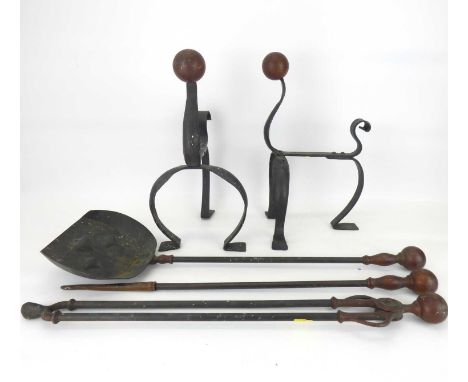 A pair of Arts &amp; Crafts copper and brass fire dogs, height 34cm and an Arts &amp; Crafts copper and steel three-piece set
