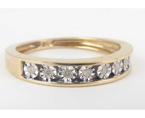 A 9ct gold half eternity ring with nine small channel set diamonds, total approx. 0.05ct, size M, approx. 1.9g.