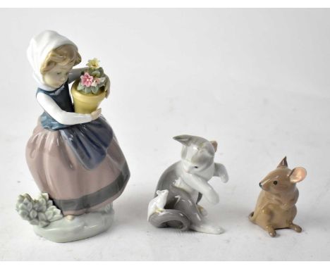 LLADRÓ; a figure of a young girl holding a flower pot, a figure of a cat with a mouse on its tail and a Beswick model of a sm