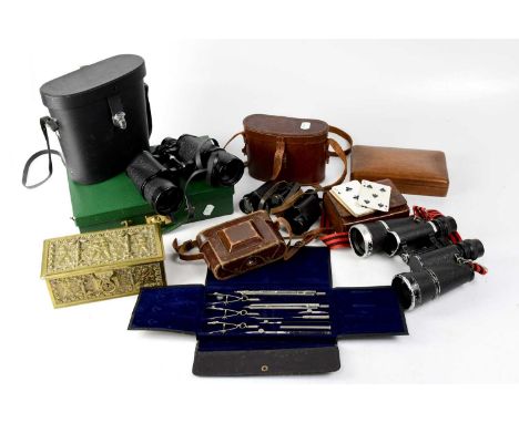 A collectors' lot comprising three pairs of binoculars, a Zeiss Ikon camera, a leather card case, a cased set of compasses an