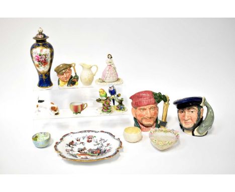A mixed lot of ceramics to include three Royal Doulton character jugs, a Royal Doulton model of a dog eating from a dinner pl